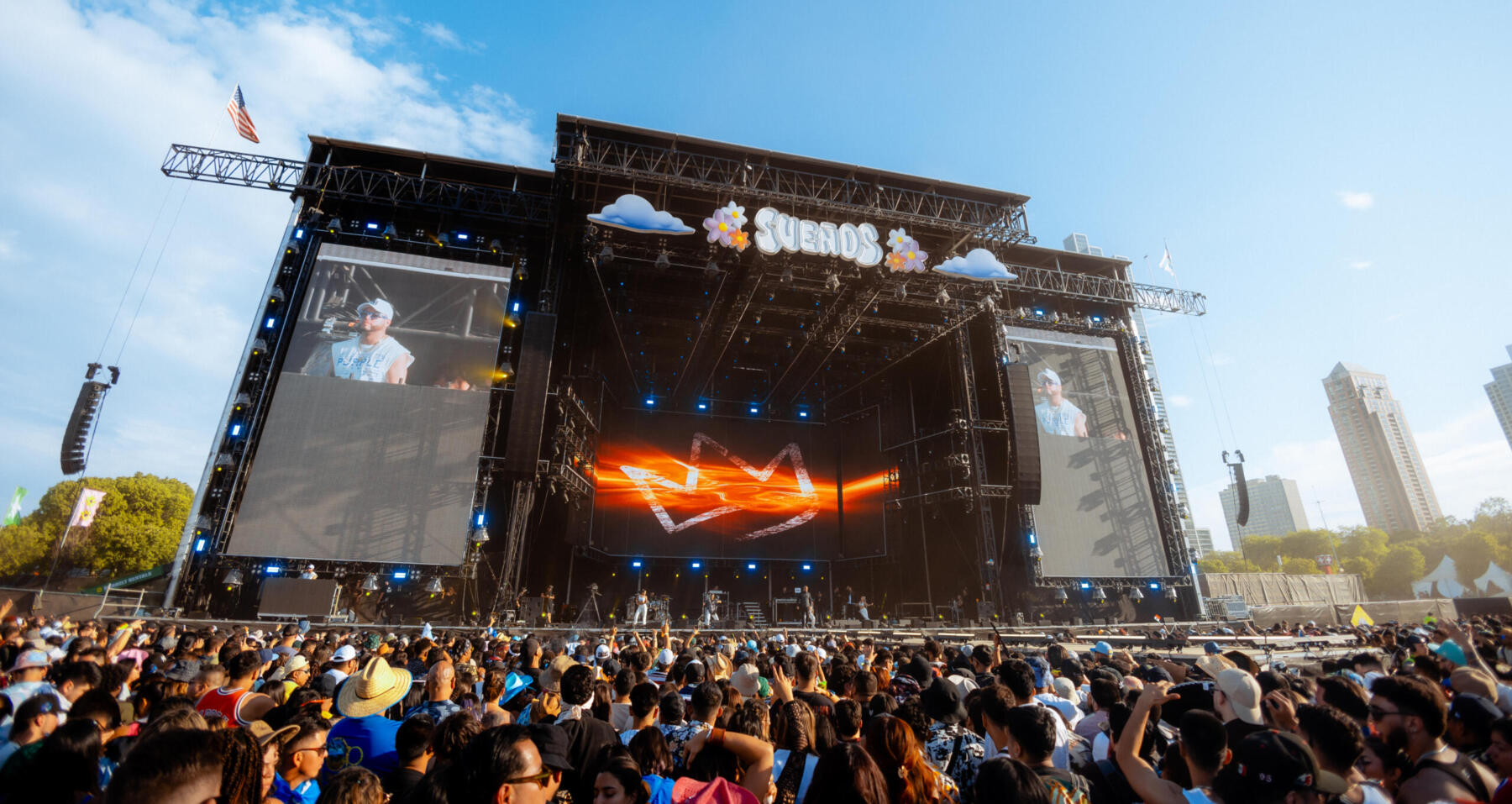 Artist shown on big screen at the Chicago Suenos Festival in Grant Park.